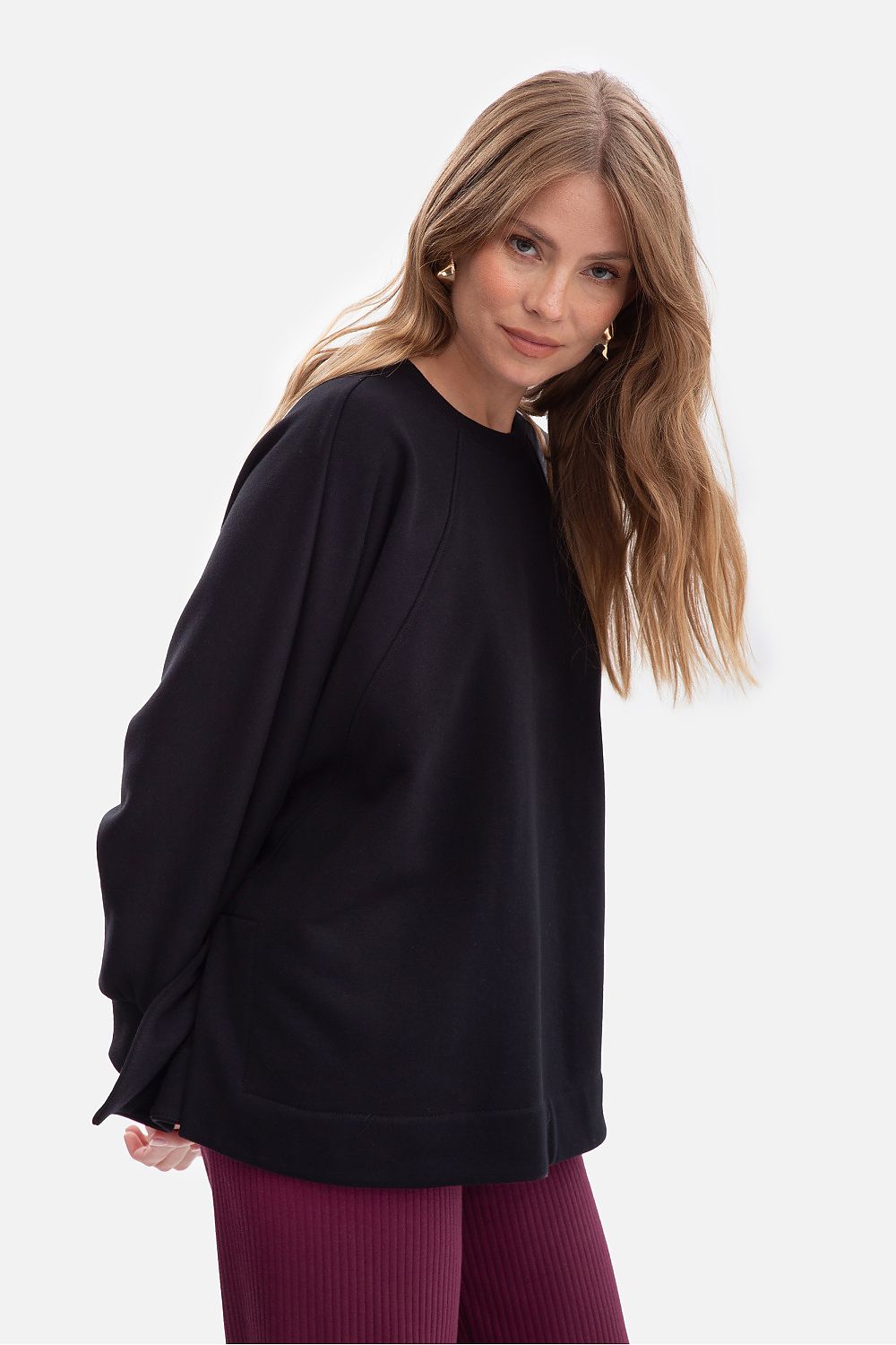 BeWear oversized women's sweatshirt displayed flat, showcasing its unique side slits and luxurious fabric quality.