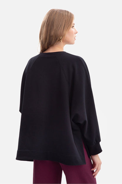 Close-up view of BeWear women's sweatshirt showcasing the soft texture and ribbed neckline, ideal for everyday elegance while maintaining a sporty aesthetic.