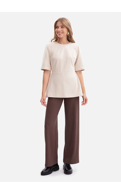 Close-up of the back view of the BeWear blouse with concealed zipper, showcasing exquisite detailing and refined design.