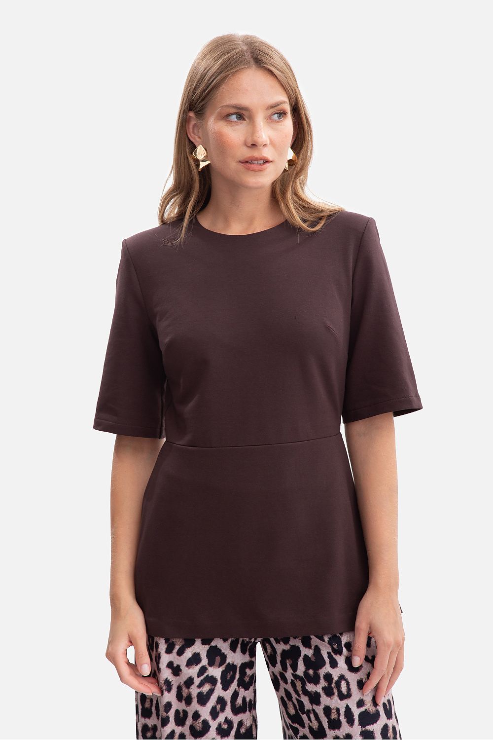 BeWear blouse draped elegantly on a model, illustrating the stylish elbow-length sleeves and flattering fit for chic occasions.