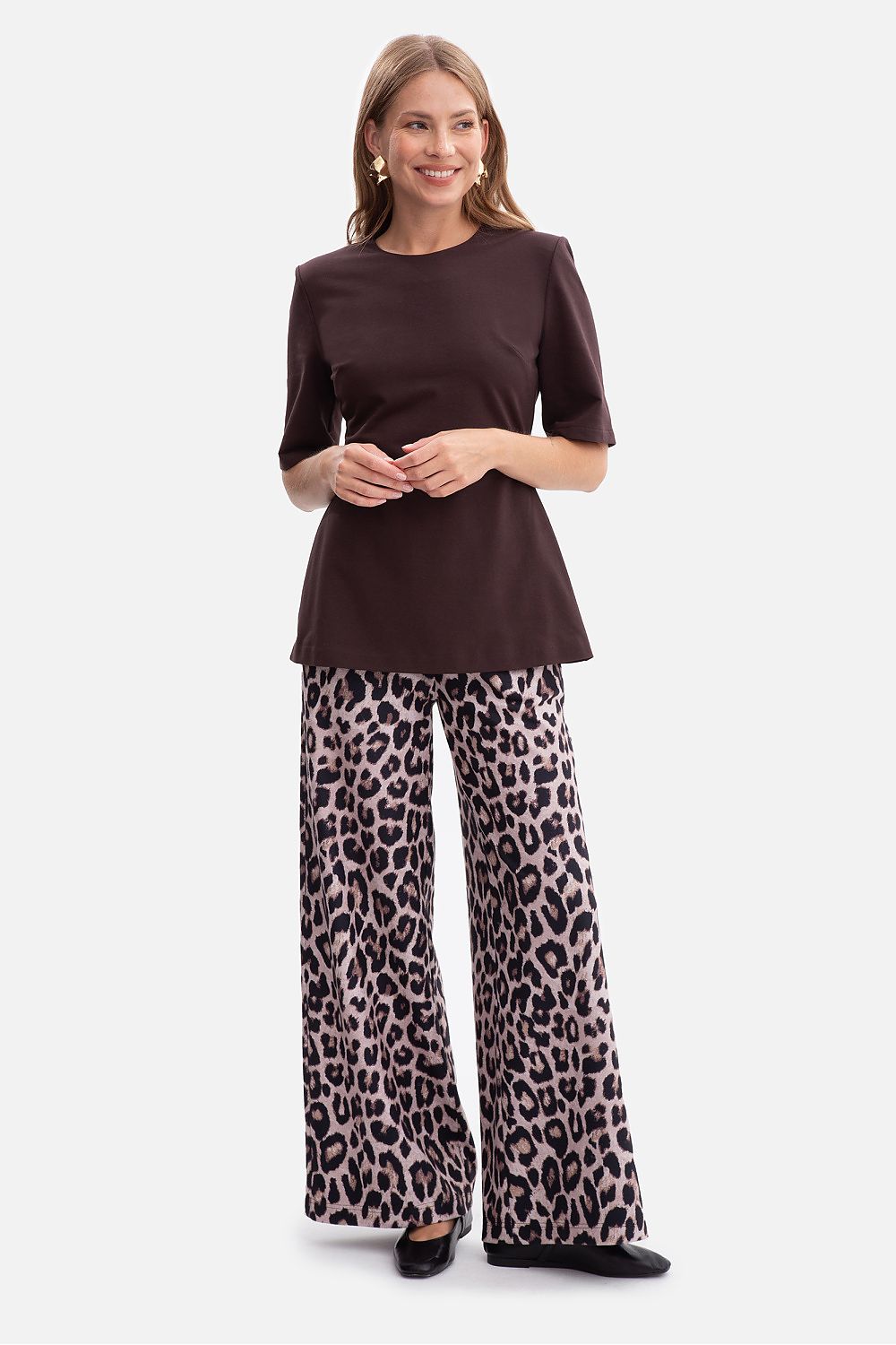 Detailed view of the flared peplum of the BeWear blouse, emphasising its graceful design and luxurious fabric quality.