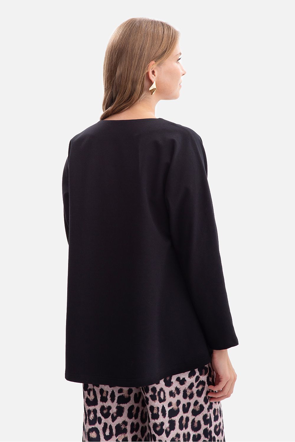 Elegantly styled BeWear oversized women's V-neck blouse made from a soft cotton blend, showcasing its relaxed fit and flattering neckline.