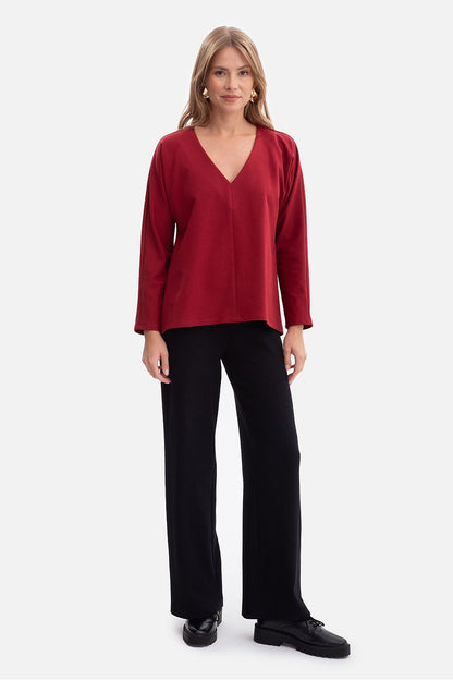Luxurious BeWear women's V-neck blouse, featuring breathability and a modern cut, crafted from premium soft cotton blend for effortless elegance.