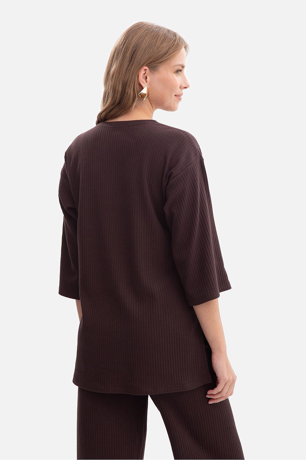 Close-up view of BeWear Women's Ribbed Blouse fabric, highlighting the luxurious ribbed texture in an elegant casual design ideal for versatile styling.