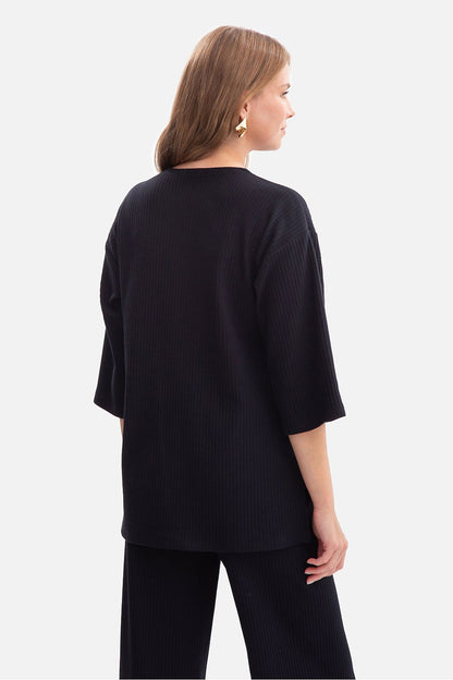 Flat lay of BeWear Women's Ribbed Blouse in sizes S, M, L, featuring the modern design and high-quality craftsmanship from Poland.