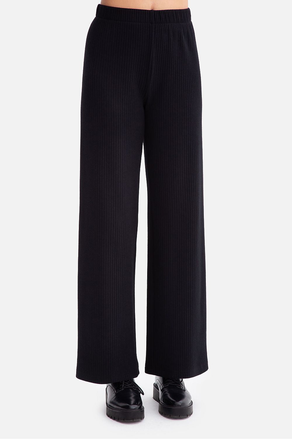 BeWear's luxurious ribbed trousers for women, crafted from soft fabric with a flattering elastic waist for an effortlessly chic look.