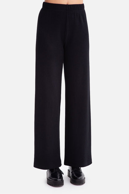 BeWear's luxurious ribbed trousers for women, crafted from soft fabric with a flattering elastic waist for an effortlessly chic look.