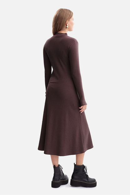 Model wearing the stylish BeWear Midi Daydress, demonstrating its fitted design and thumb cutout sleeves.