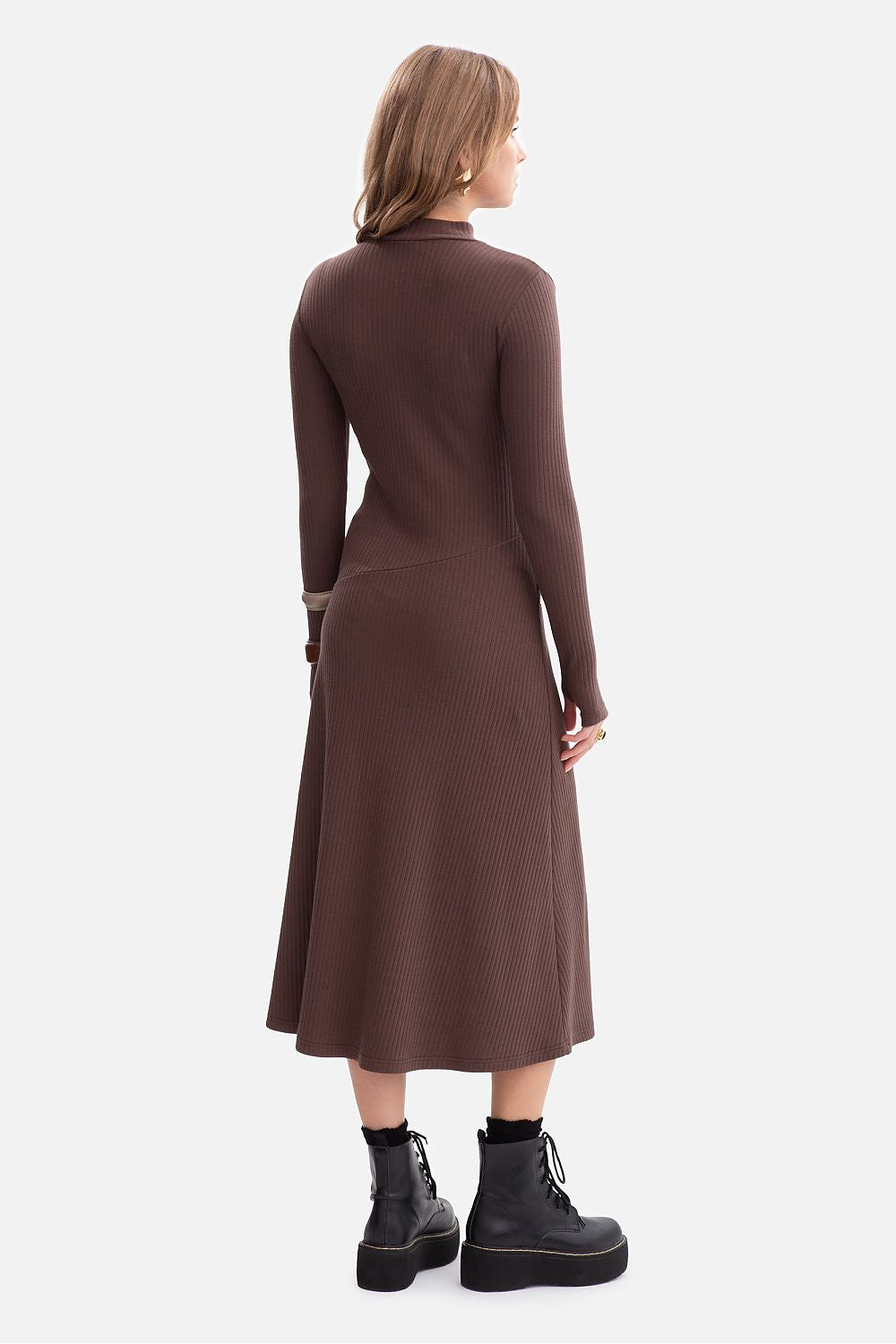 Model showcasing the BeWear elegant midi dress with long fitted sleeves and flared bottom, ideal for adding a touch of luxury to everyday wear.