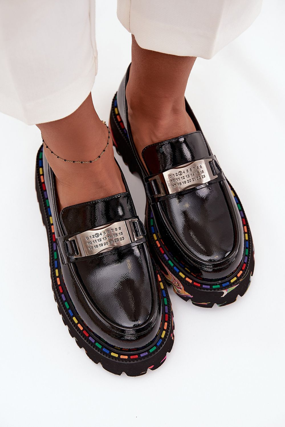 Artiker women's moccasins in patent leather displayed elegantly, highlighting their unique design and luxurious feel, curated by Step in Style.
