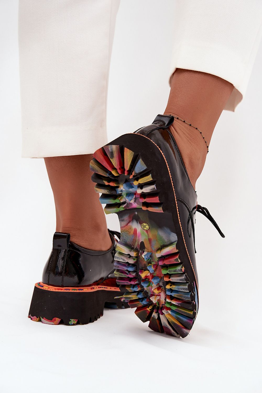 Close-up view of luxurious Step in Style women's patent leather shoes, showcasing the sleek design and high-quality materials.