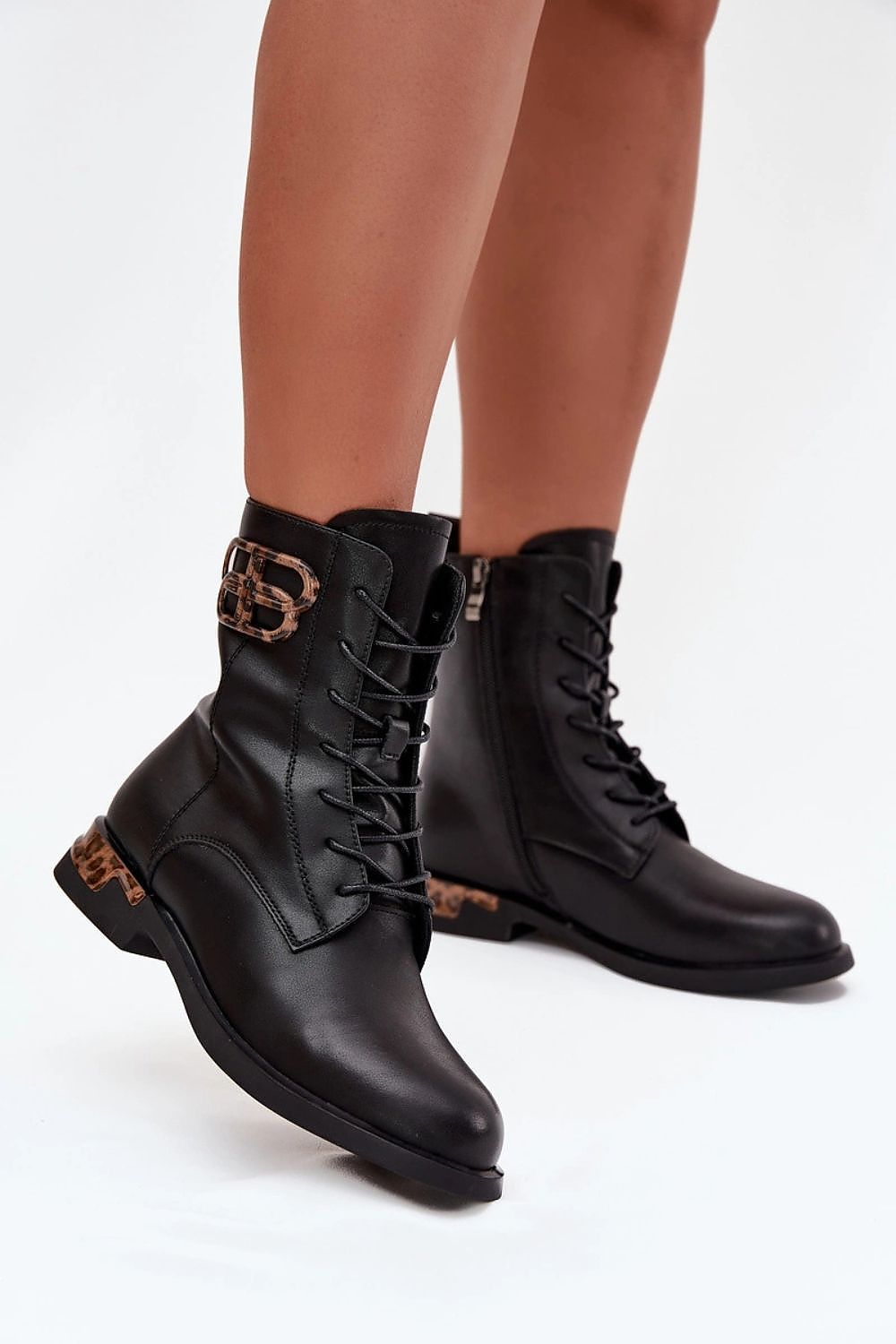 Elegantly crafted women's natural leather boots by Step in Style featuring a stylish zipper and lacing, comfortable flat heel, and insulated interior for warmth, available in EU sizes 36-41.