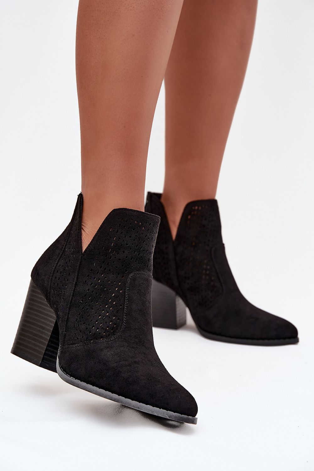 Elegant women's ankle boots by Step in Style crafted from eco suede with unique cut-outs and a refined back zipper for easy wear, enhancing any sophisticated wardrobe.
