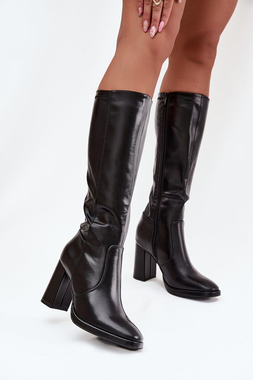 Close-up of Step in Style women's eco leather heel boots showcasing the luxurious finish and practical zipper design, perfect for chic winter outfits.