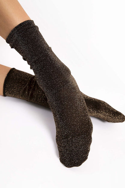 High-quality Fiore socks crafted with Lurex and Spandex, offering durability and a pressure-free invisible cuff for a sleek look.
