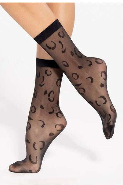 Gatta Women’s Elegant High Socks displayed in a stylish setting, illustrating the delicate pattern and luxurious semi-matte finish.
