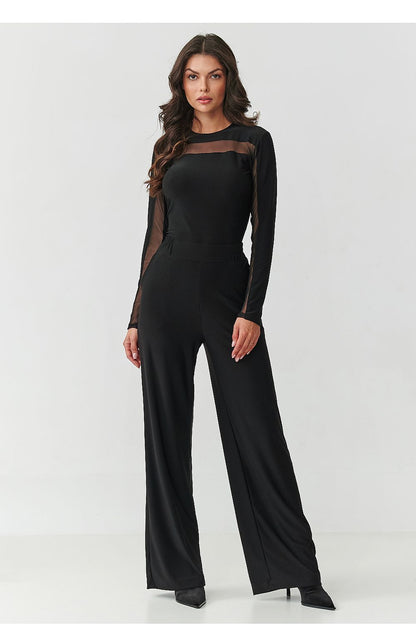 Stylish black women's clothing set featuring a fitted blouse and wide-legged trousers, designed by Makadamia, perfect for a luxurious and elegant look.
