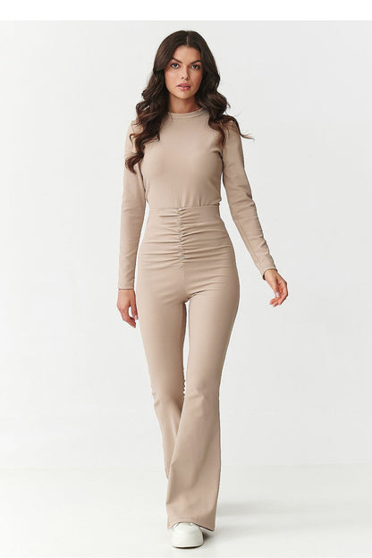 High-waisted flared pants from Makadamia, designed to accentuate the waist and legs, crafted from premium ribbed material for a sophisticated silhouette.