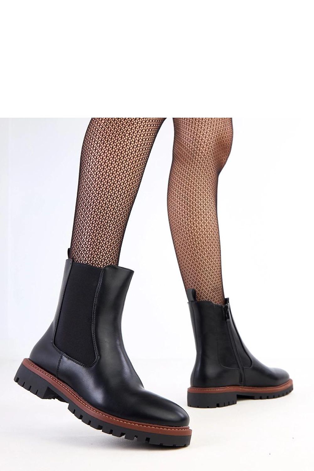 Close-up of Solea women's ankle boots in eco leather, showcasing the premium craftsmanship and zipper closure for easy wear.