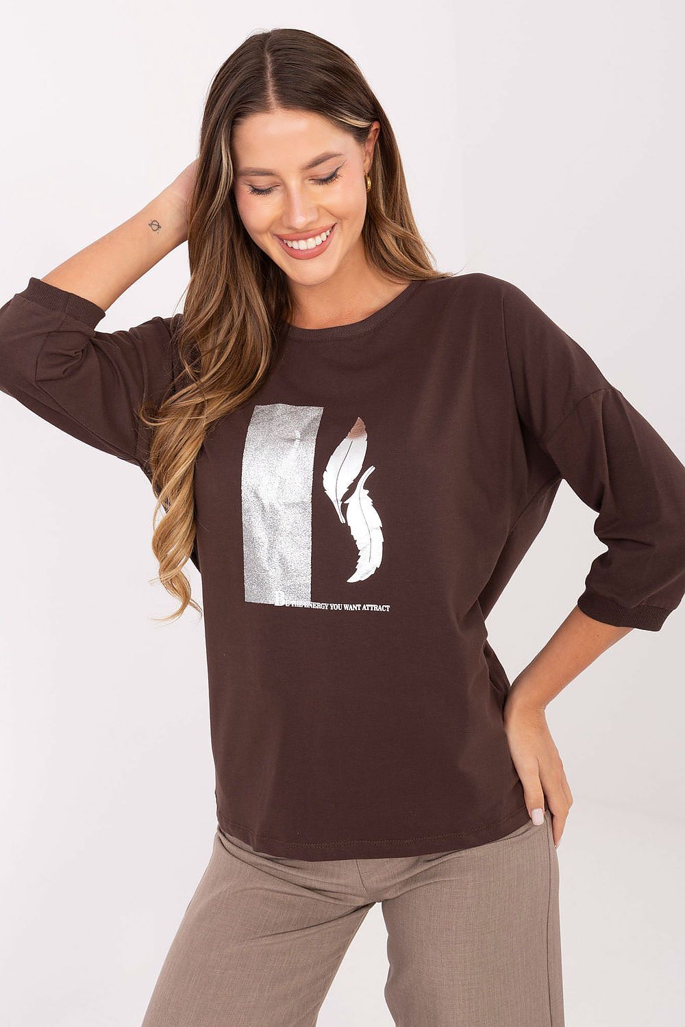 Stylish detailed view of a Relevance cotton blouse with metallic accents, showcasing the soft texture and comfortable fit ideal for sophisticated casual outfits.