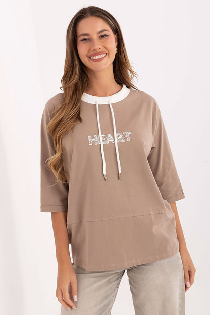 Elegant 3/4 sleeve cotton blouse by Relevance, featuring intricate embroidery and adjustable drawstrings, perfect for a casual yet chic outfit.