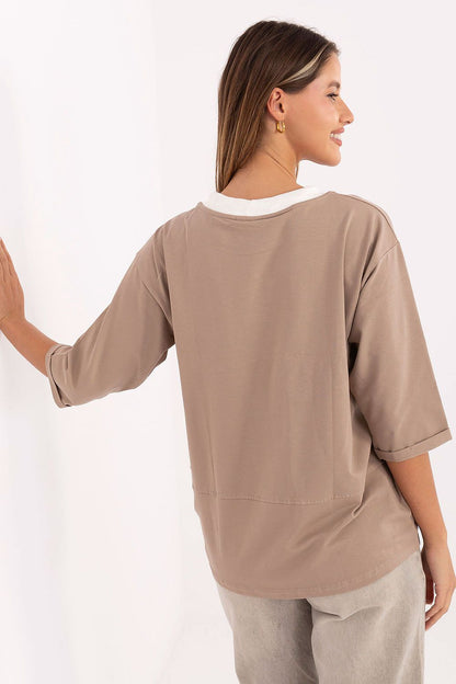 Elegant 3\/4 sleeve cotton blouse by Relevance featuring intricate embroidery and drawstrings, perfect for casual outings.
