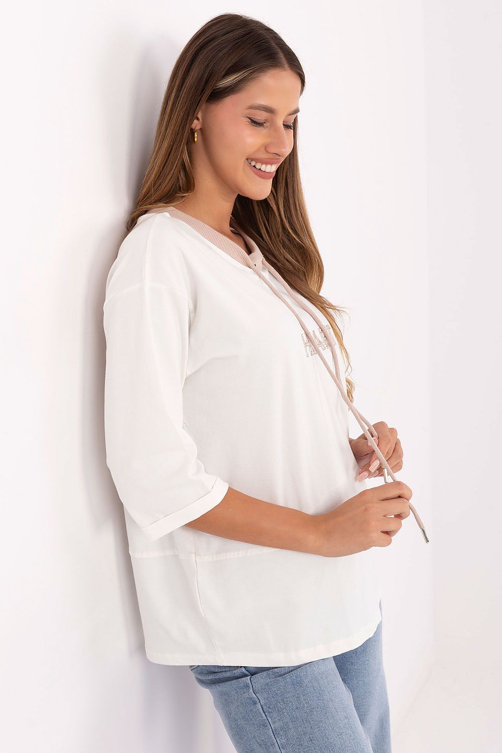 Soft cotton blouse by Relevance with 3\/4 sleeves and a classic round neckline, ideal for casual elegance.