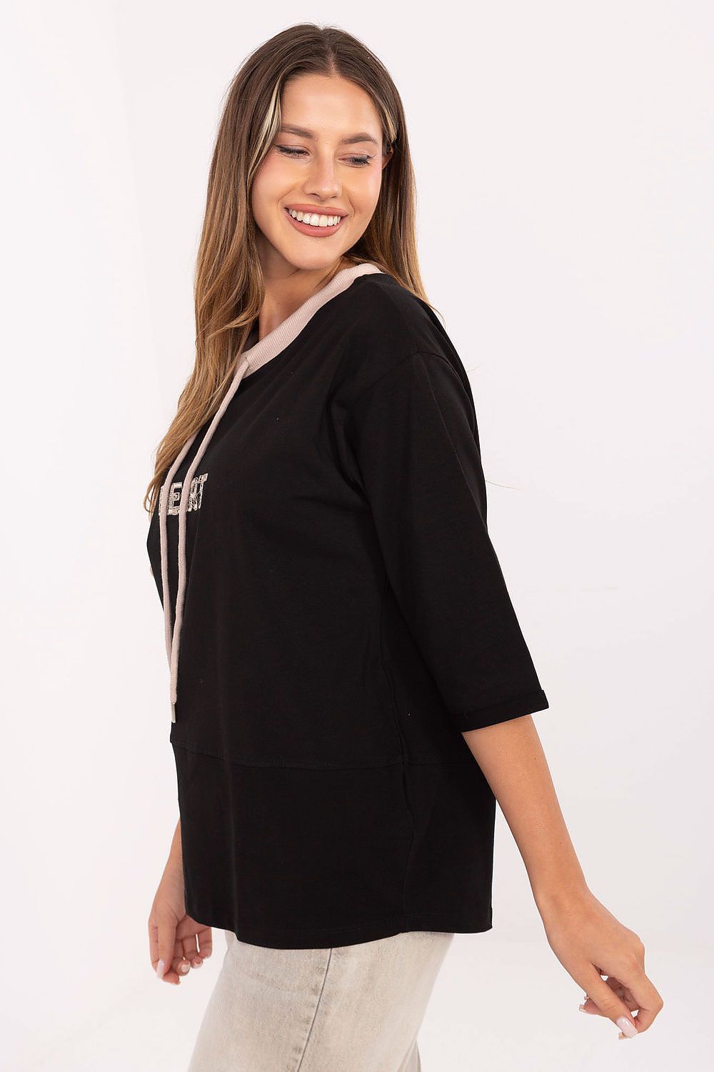 Elegant 3/4 sleeve cotton blouse with intricate embroidery and drawstrings, perfect for casual styling, by Relevance.