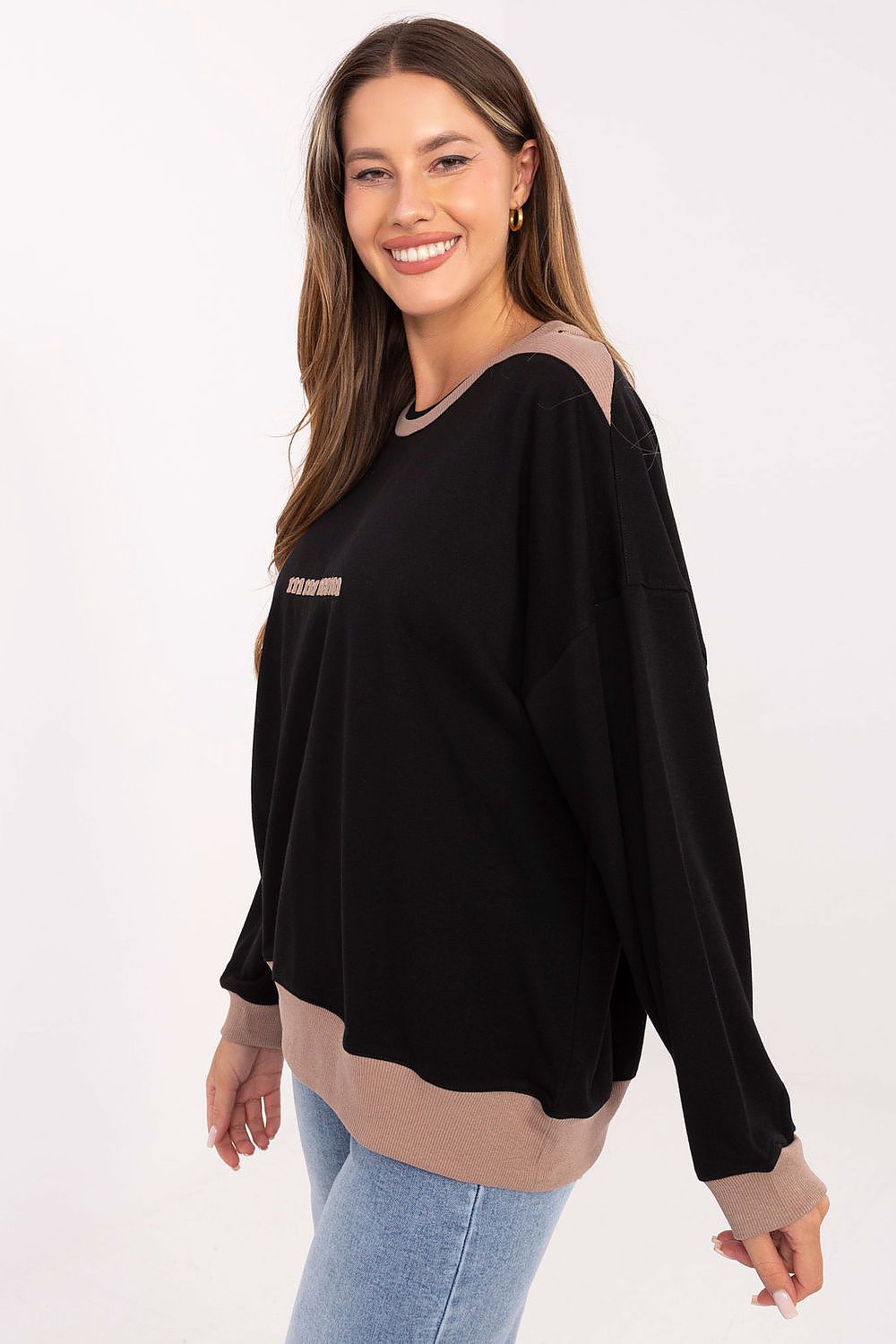 Close-up of soft cotton blend fabric of Relevance women's embroidered sweatshirt, highlighting quality and luxury.