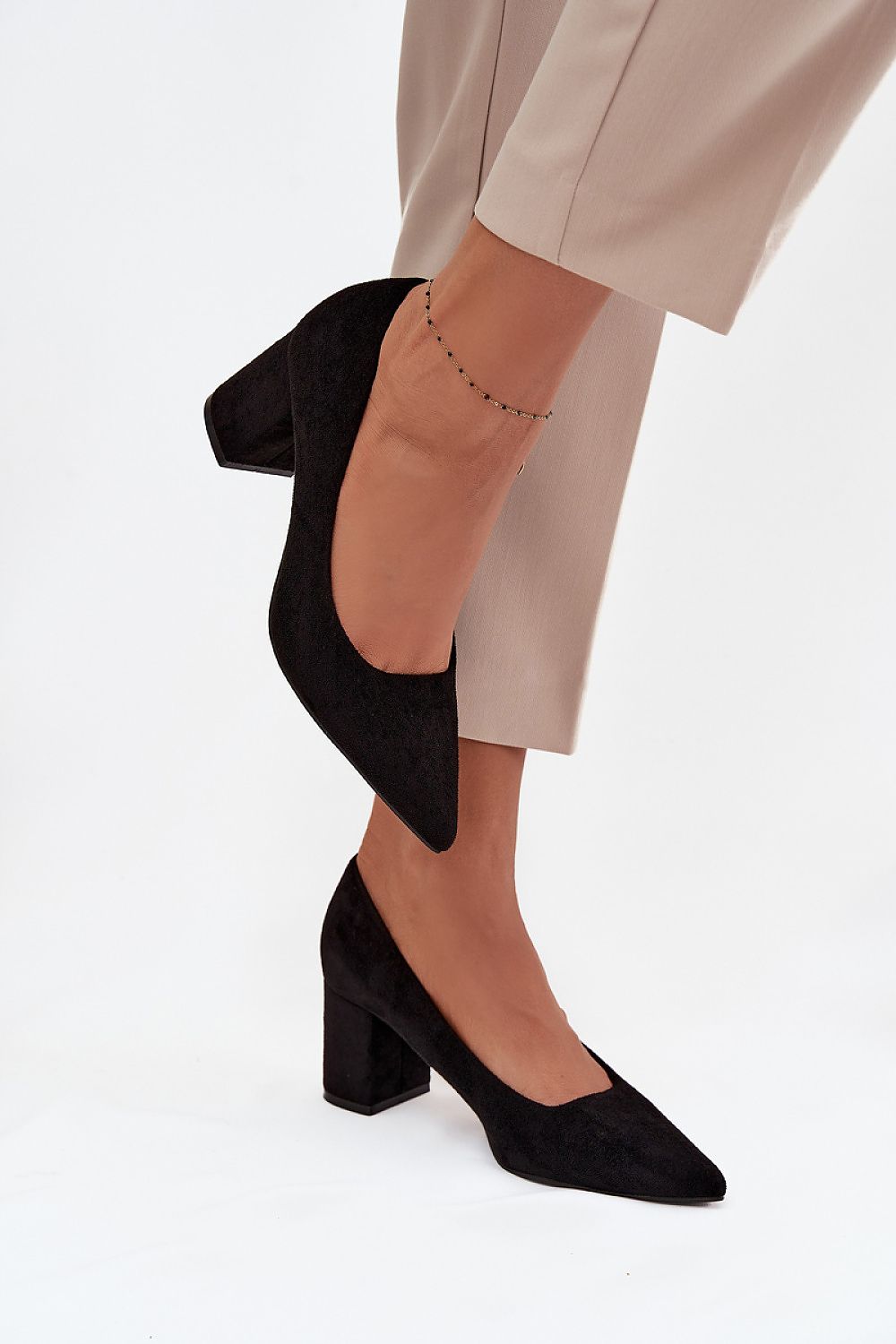 Step in Style's chic women's pumps made from eco suede, designed with a stylish pointed toe and comfortable block heel, elevating any wardrobe with elegance.