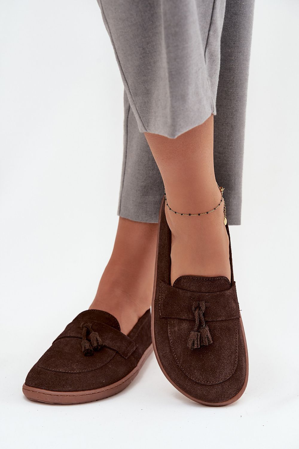Luxury women's suede moccasins by Step in Style featuring elegant tassels, perfect for stylish casual or elegant outfits.