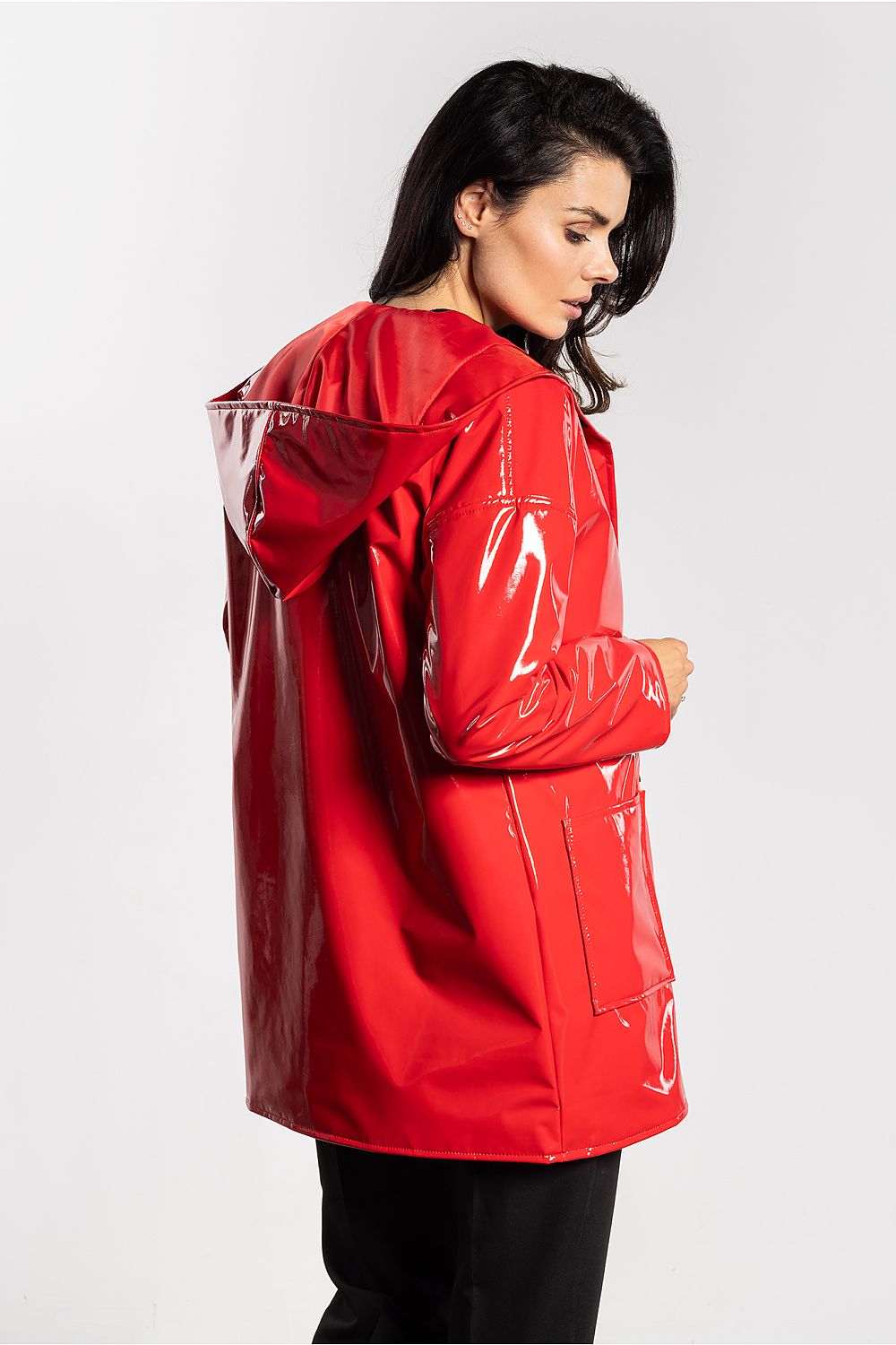 Luxury women's latex jacket with hood by Awama, designed with a contemporary silhouette and functional pockets, emphasising elegance and practicality for any occasion.