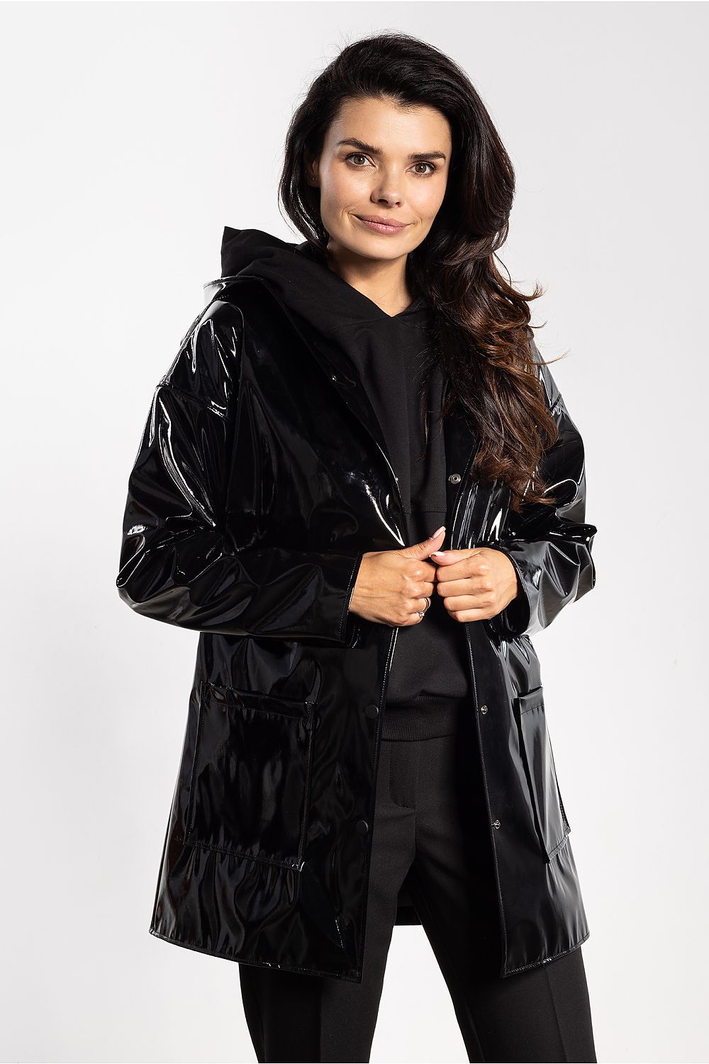 Stylish hooded latex jacket for women by awama, adorned with practical pockets and a sleek design, suitable for casual outings.