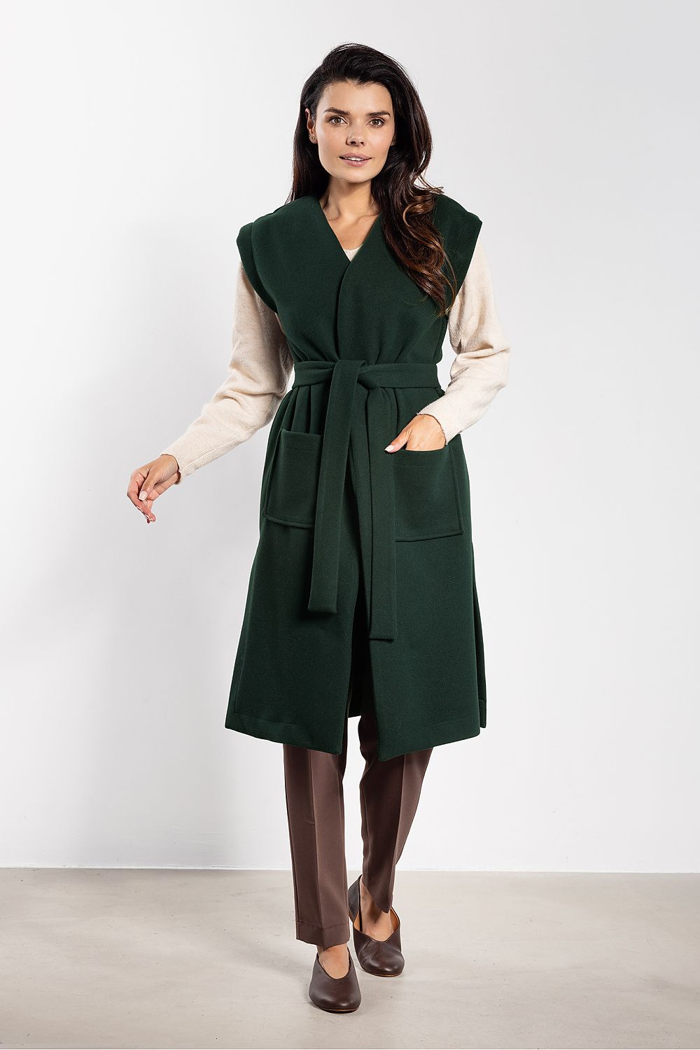 Chic long fleece vest for women with side slits and large pockets, designed by awama for a fashionable look.