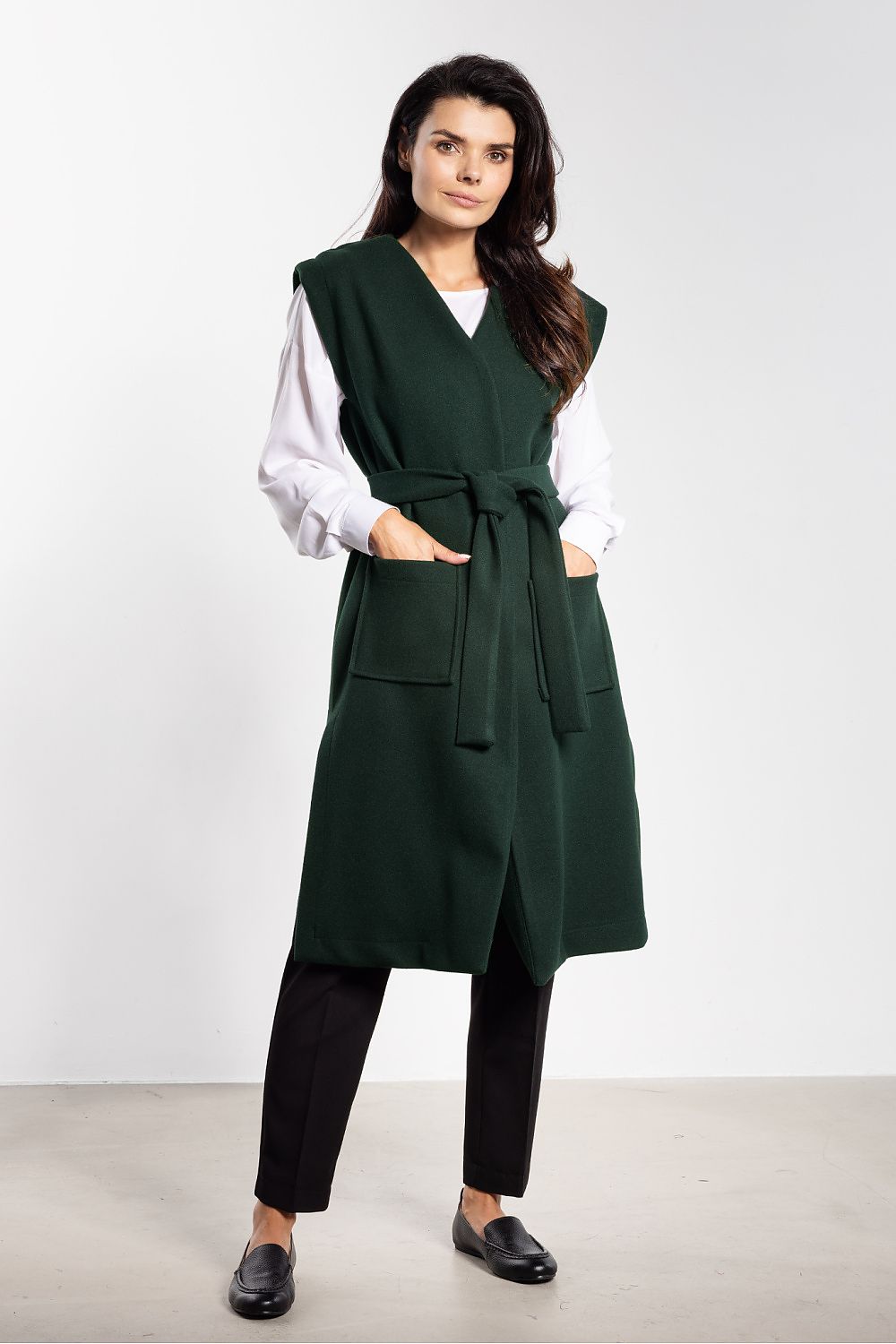 Stylish women's gilet vest in soft fleece, highlighted with a wrap-around belt, by luxury brand awama.