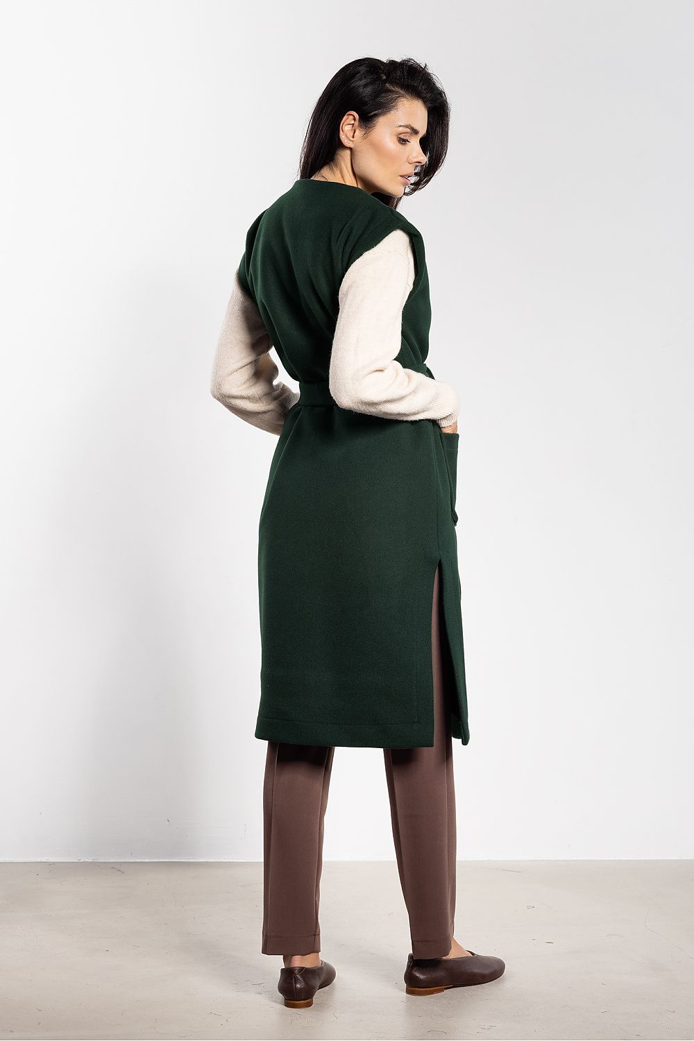 Fashionable women's fleece vest featuring a sophisticated belt and practical pockets, available from awama.