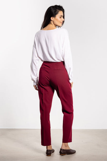 Awama high-waist cigarette pants in luxurious fabric, showcasing timeless style suitable for any occasion.