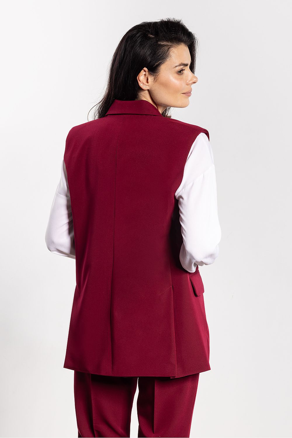 Stylishly paired outfit with Awama Gilet Vest for Women, showcasing versatility for both professional and casual occasions, epitomising luxury style.