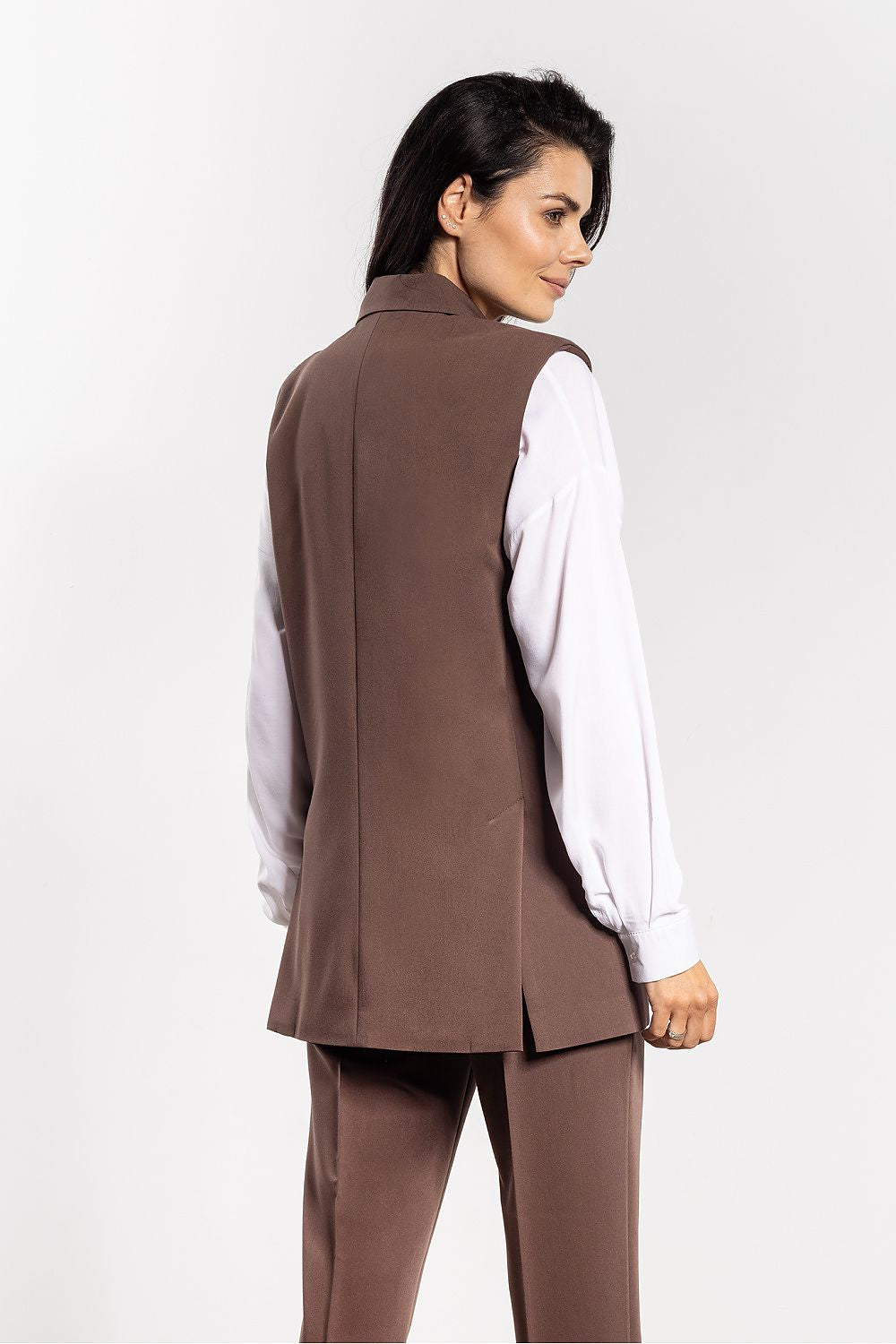 Versatile Awama gilet vest worn with modern trousers, illustrating its timeless appeal for smart-casual outfits.
