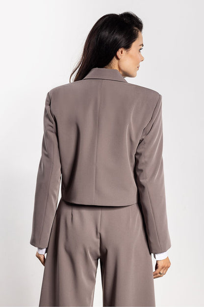 Stylish loose cut jacket by Awama, featuring classic lapels for a timeless look, ideal for various occasions.