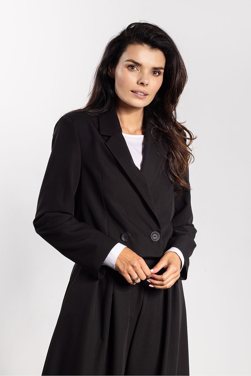 Back view of the Awama double-breasted jacket, featuring a straight shoulder line and professional silhouette for a tailored yet comfortable fit.