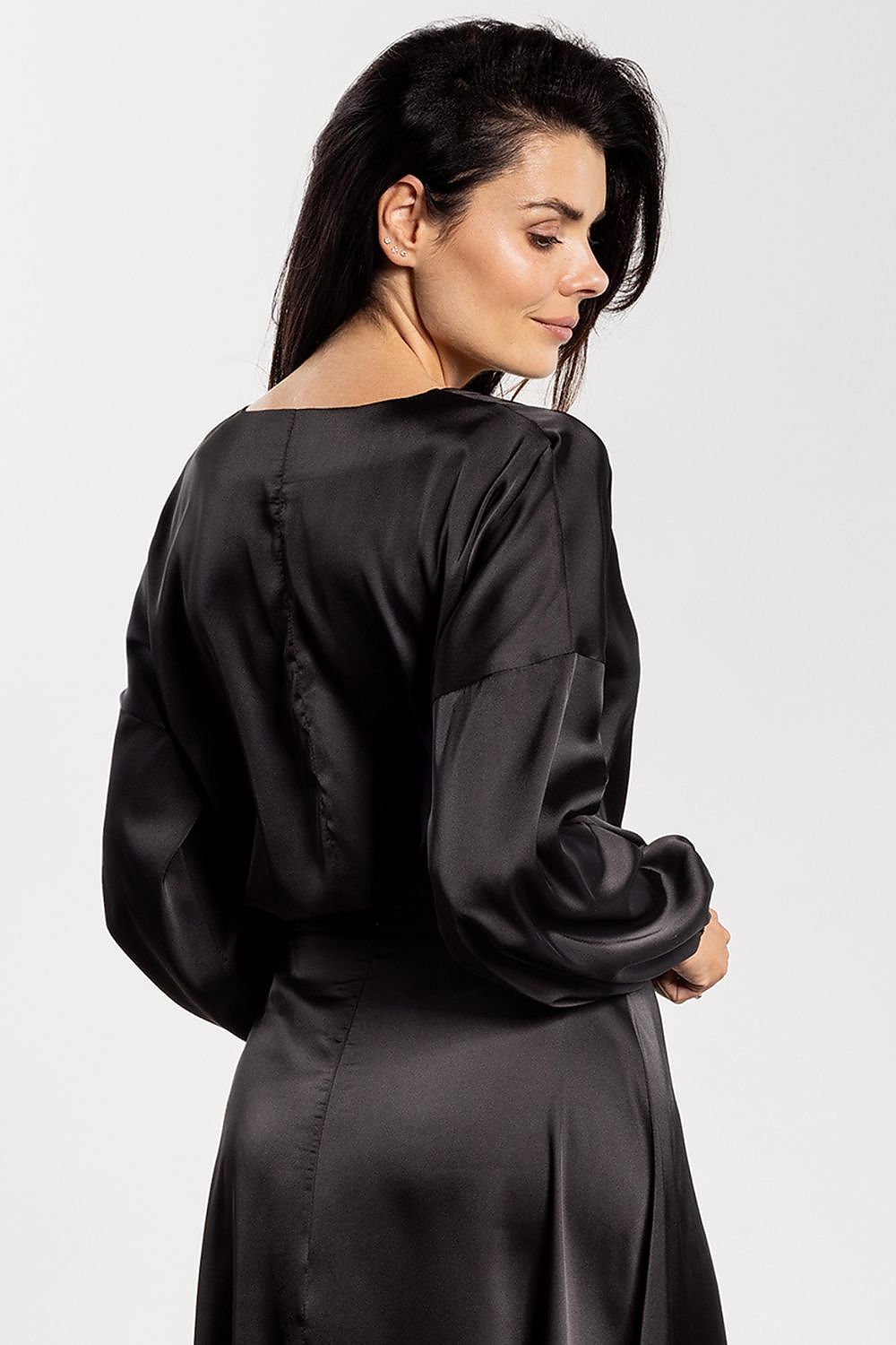 Back view of Awama's satin blouse highlighting the soft flowy silhouette and stylish V-neck, perfect for layering or standalone elegance.