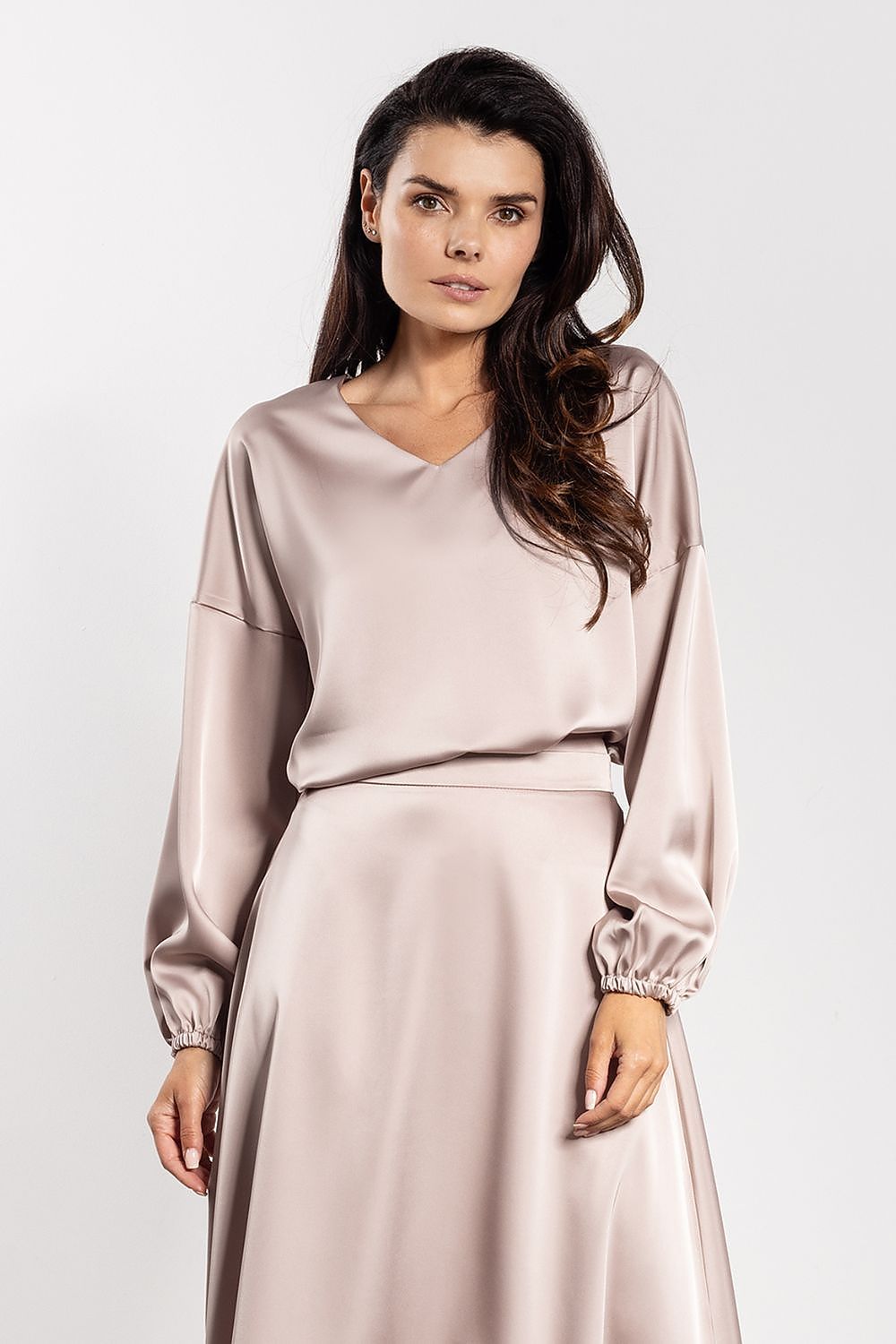 Detailed size chart for Awama's elegant satin blouse, providing dimensions for EU S to XL, designed for the modern, sophisticated woman.