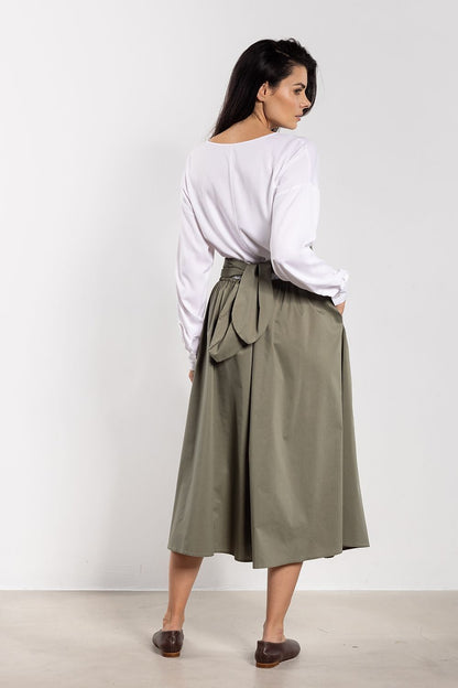 Sophisticated midi skirt with a flattering high waist and flared design, exclusively from Awama, ideal for chic ensembles.