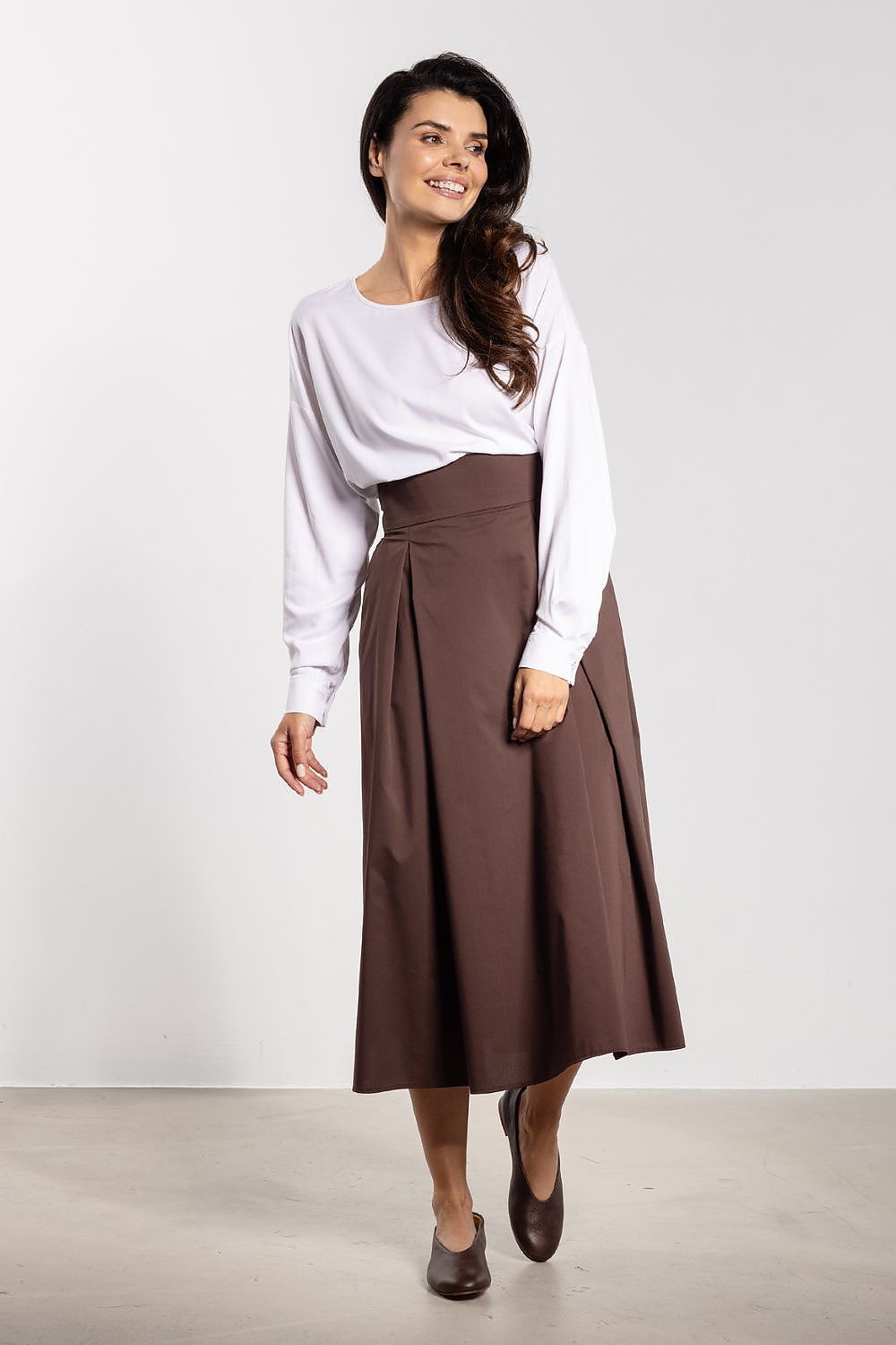 Elegant high waist midi skirt by Awama showcasing a flared bottom design, perfect for luxurious everyday outfits.