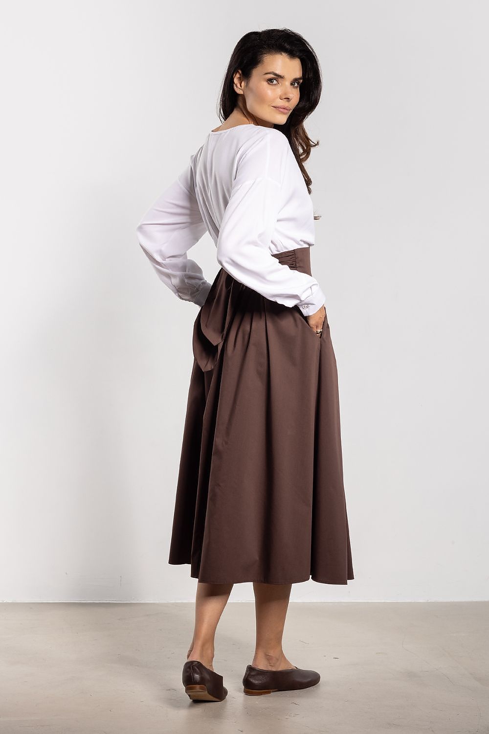 High quality cotton blend midi skirt by Awama with a tie-back belt, blending comfort and elegance for versatile styling.