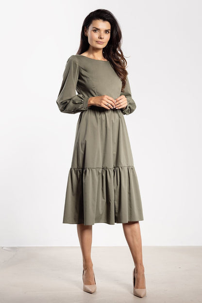 Stylish Awama midi dress in sizes S-XL, featuring a fitted top and flared bottom that accentuates feminine charm.