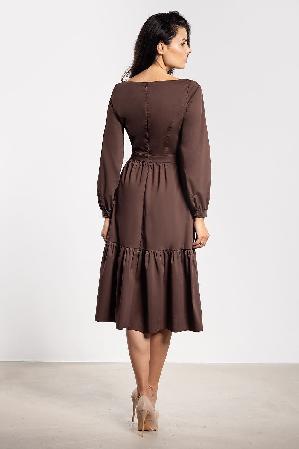 Stunning Elegant Awama midi dress with romantic flared silhouette, showcasing delicate ruffle details and long sleeves, perfect for luxurious occasions.