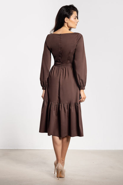 Stunning Elegant Awama midi dress with romantic flared silhouette, showcasing delicate ruffle details and long sleeves, perfect for luxurious occasions.