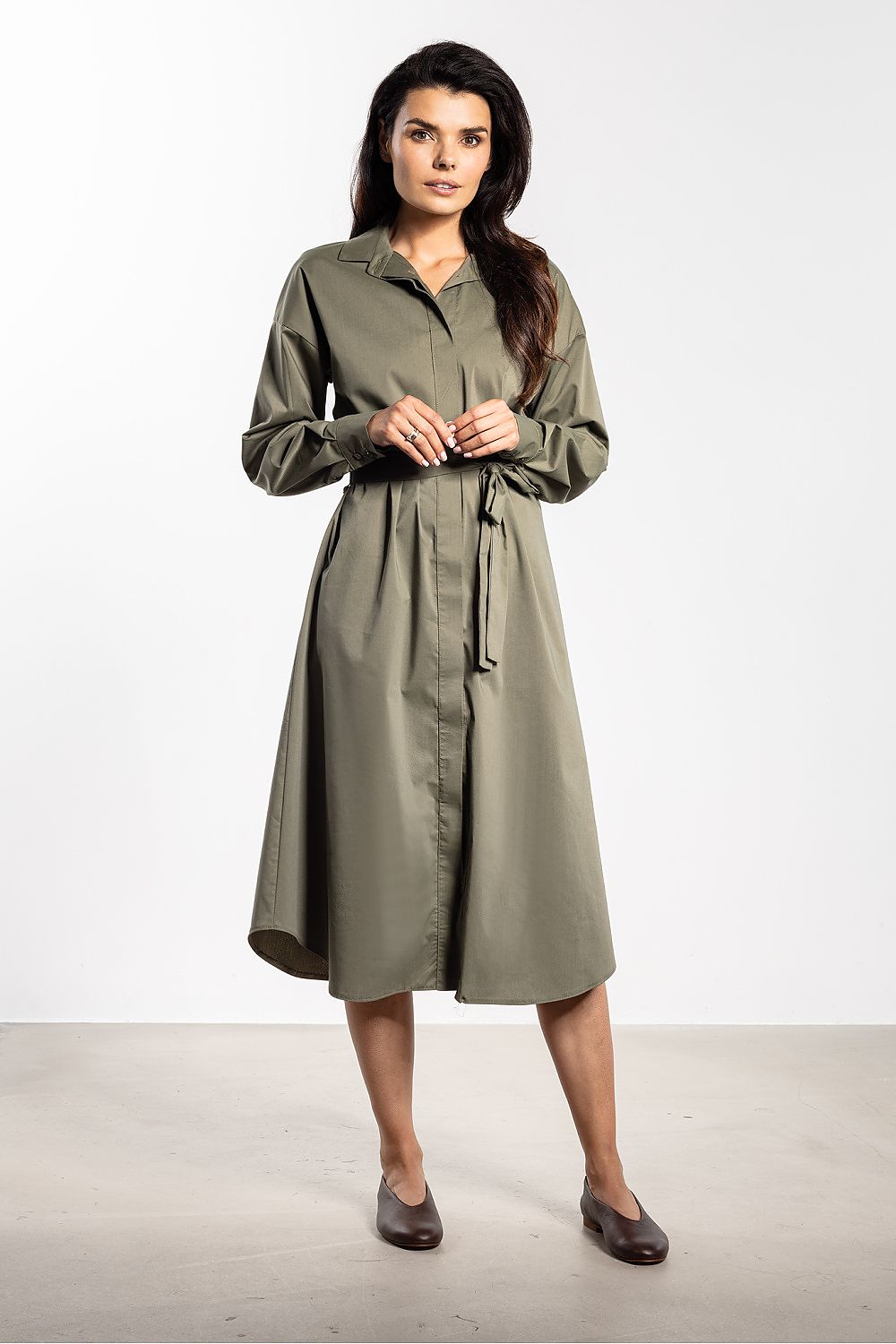 Elegant midi shirt dress by Awama featuring a classic collar, button detail, and belted style, ideal for versatile occasions. Crafted from a premium blend of cotton, nylon, and spandex, available in sizes S-XL. Perfect for a chic work look or special event.